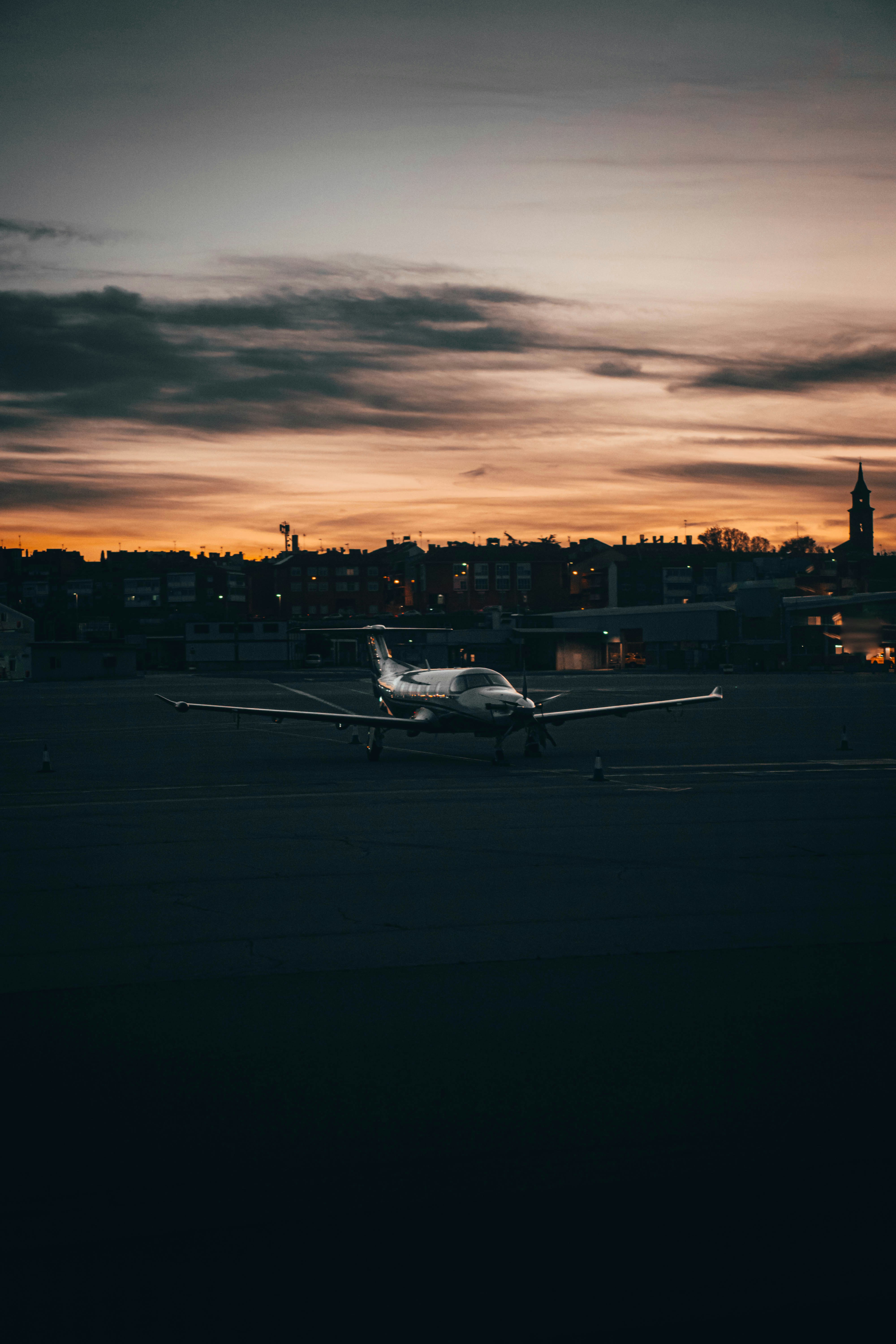 A small plane is sitting on the runway